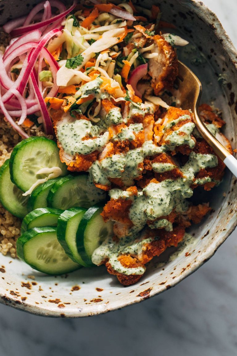 Crispy chicken tikka bowls with rice and cucumber.